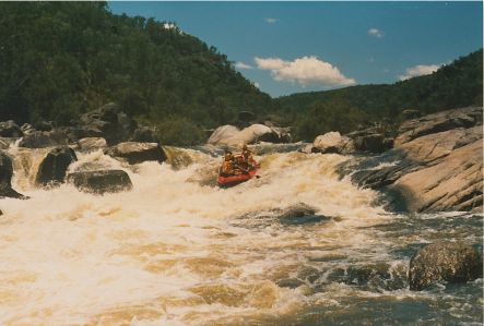 Rob Black Rafting Guide entering rapid