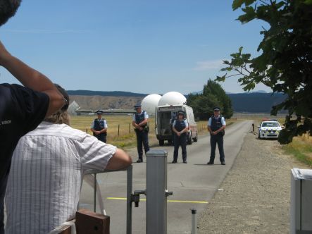 Waihopai Police confront protestors who later jumped the gate and entered Waihopai base perimeter small